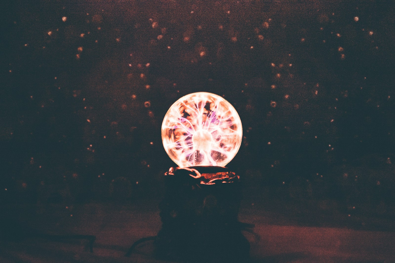 multicolored plasma ball in dim light room